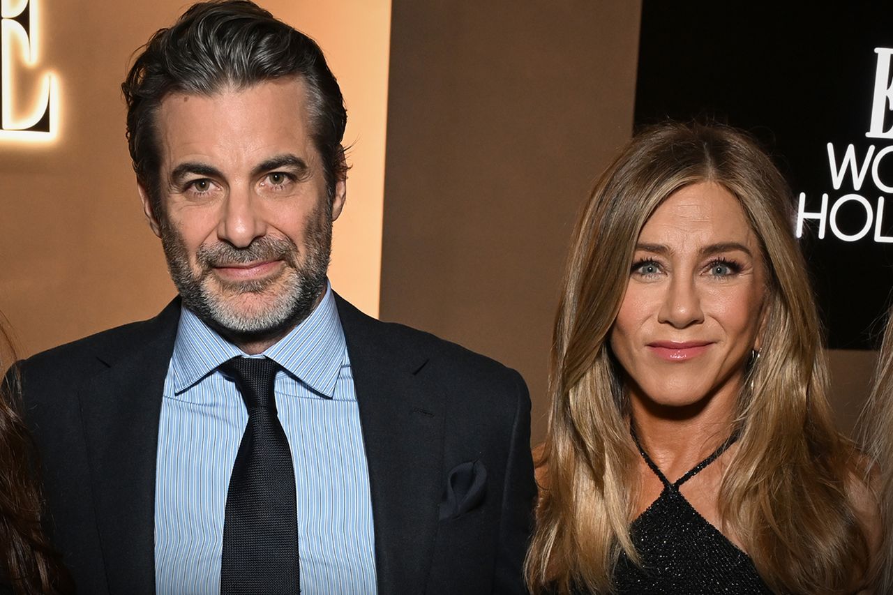 Michael Kovac/Getty Jim Curtis and Jennifer Aniston attend ELLE's 2025 Women in Hollywood on November 17, 2025 in Los Angeles, California.