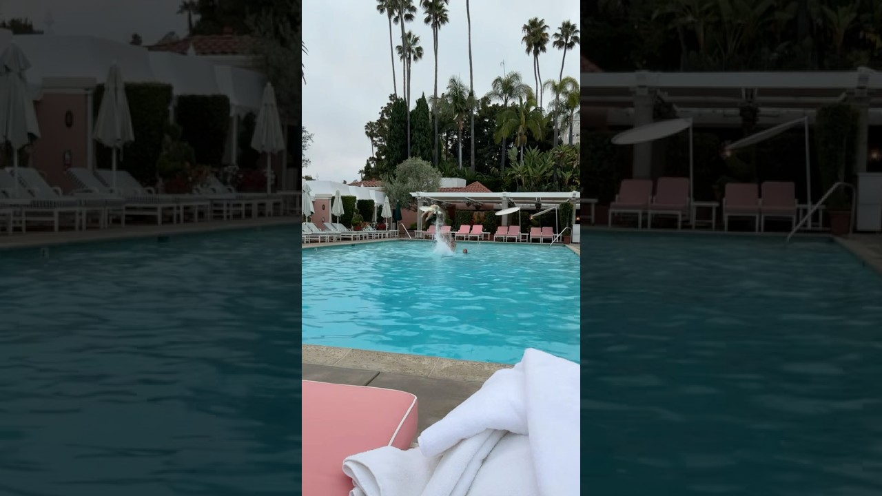 Athletic child performs a daring acro flip in the pool