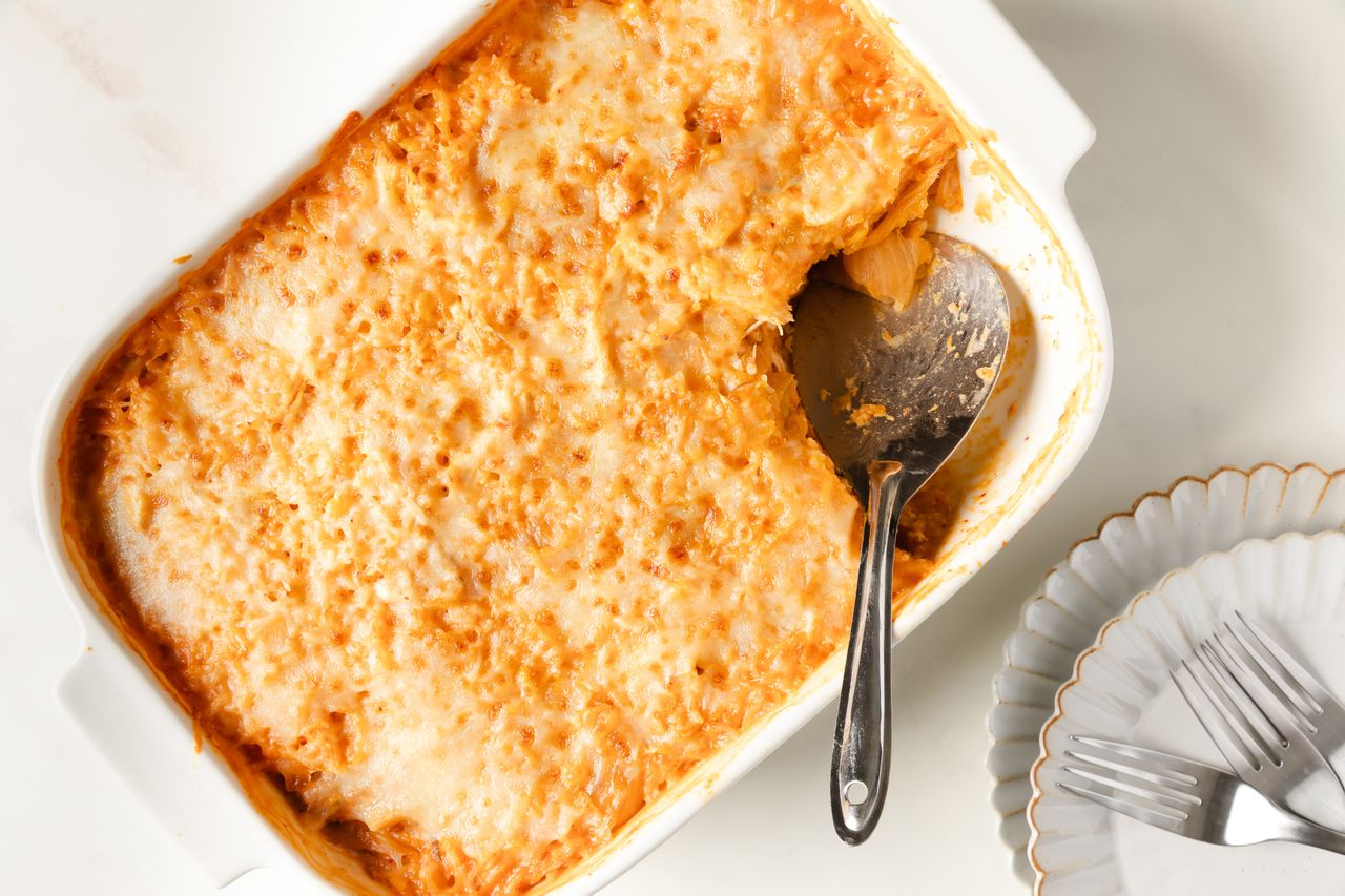 Chicken, Corn, and Tangy Cabbage Casserole in a baking dish with a serving spoon