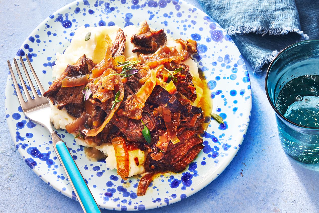 Southern Living French Onion Pot Roast on a plate to serve with mashed potatoes