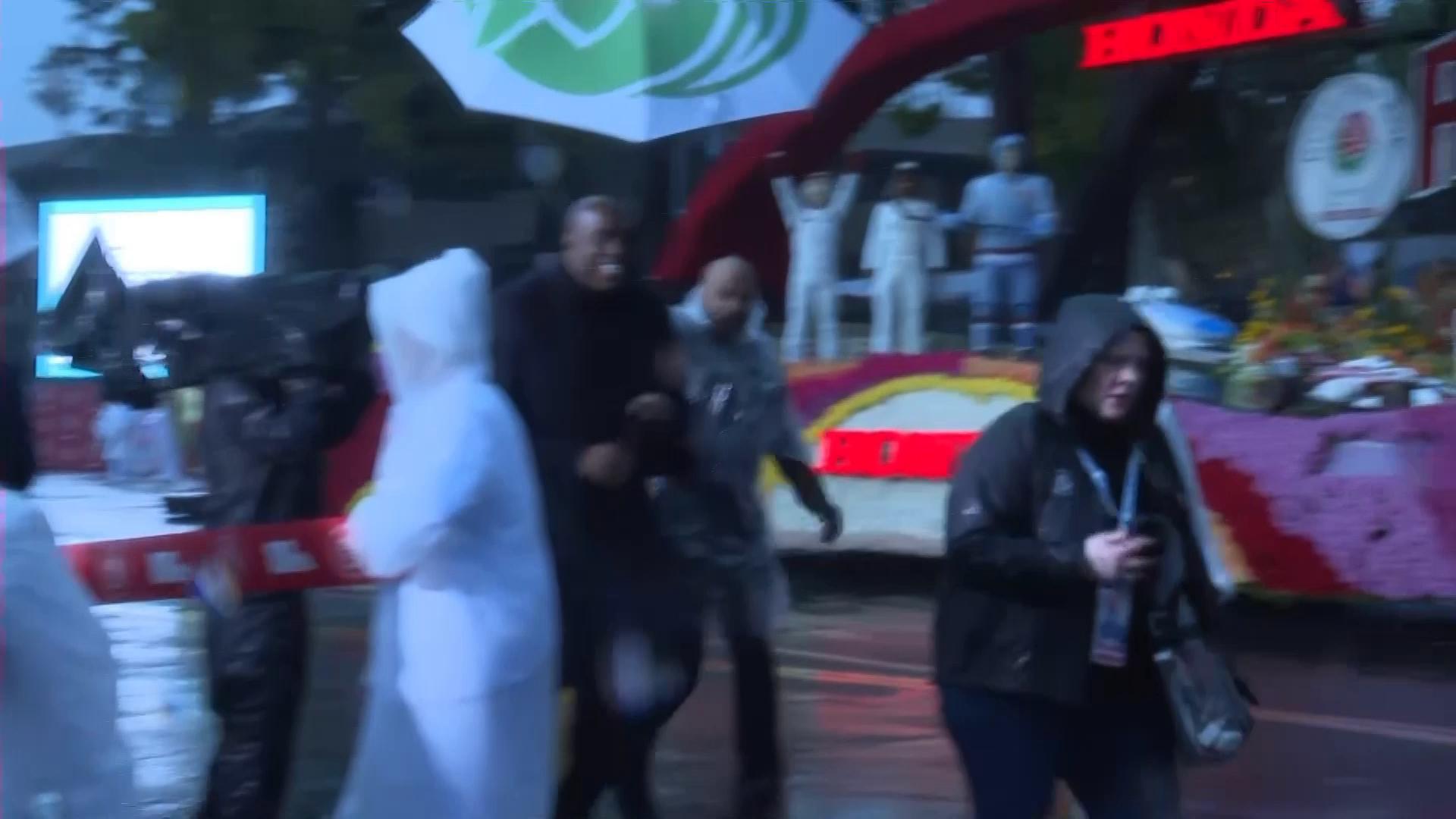 Iconic Rose Parade marched on as rain poured for the first time in 20 years