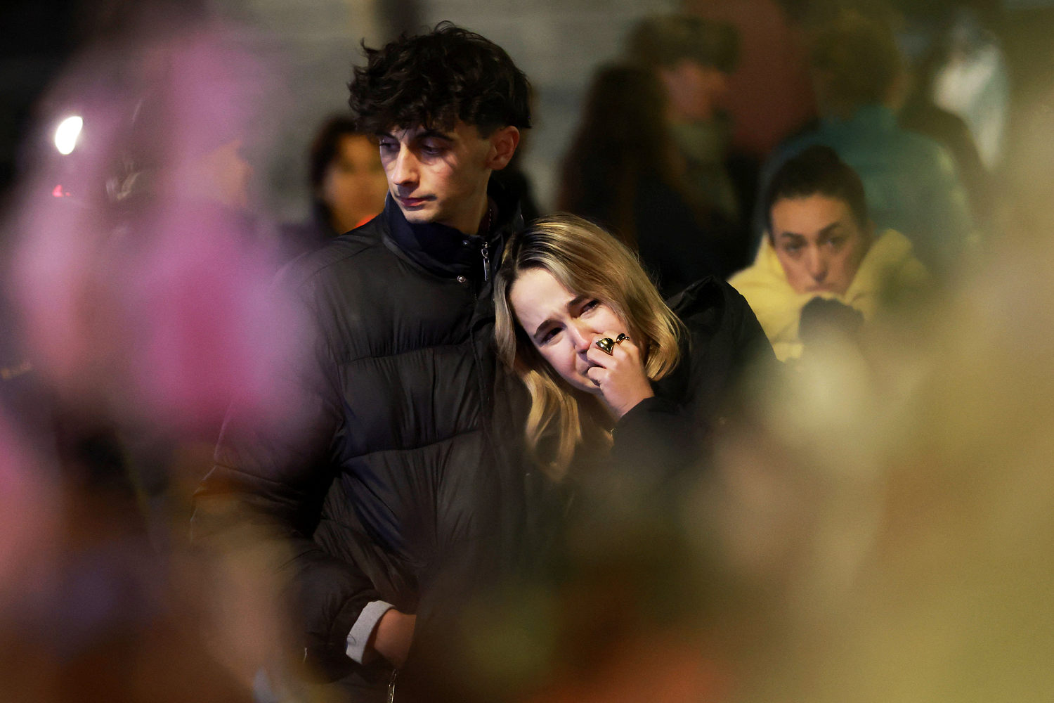 People gathered outside Le Constellation bar in the Crans-Montana ski resort on Thursday. (Stephanie Lecocq / Reuters)