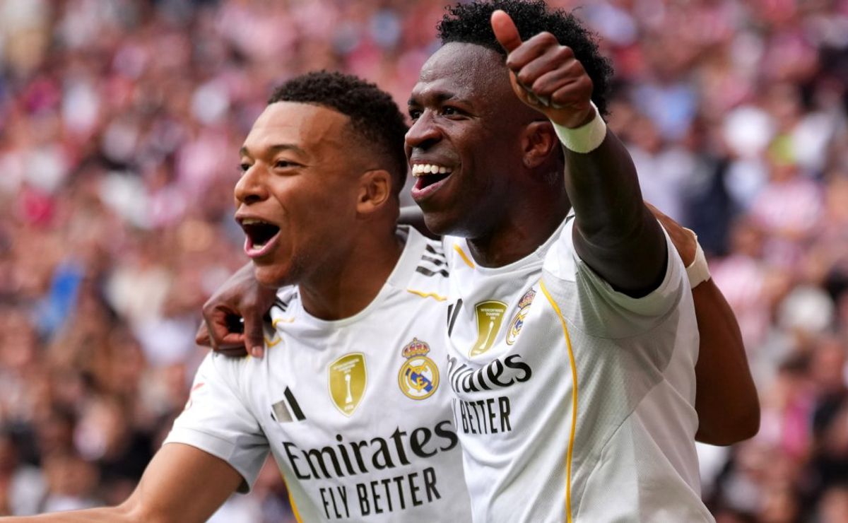 Kylian Mbappe of Real Madrid (L) celebrates scoring a goal with Vinicius Jr.