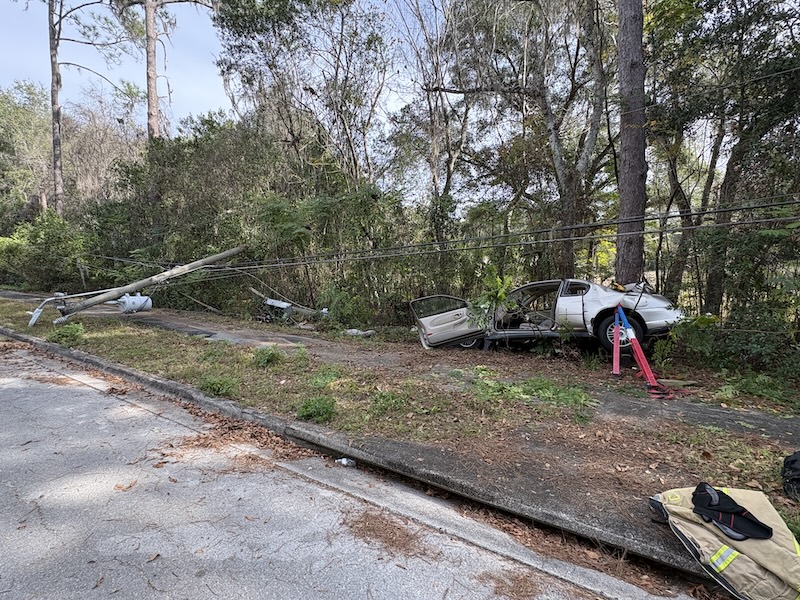 Photos: One person extricated from vehicle after hitting power pole