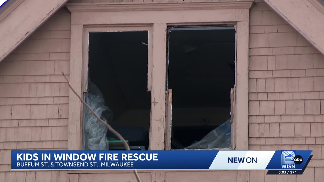 Two children hanging from attic window rescued in Milwaukee house fire