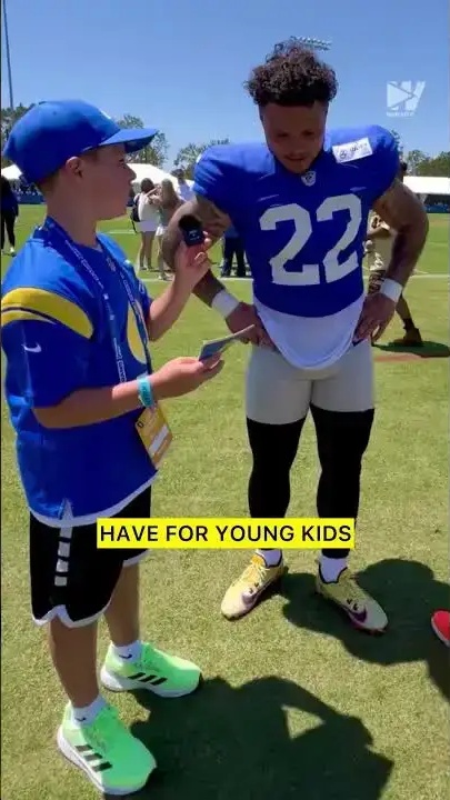 Blake Corum touchdown celly with kid sports reporters