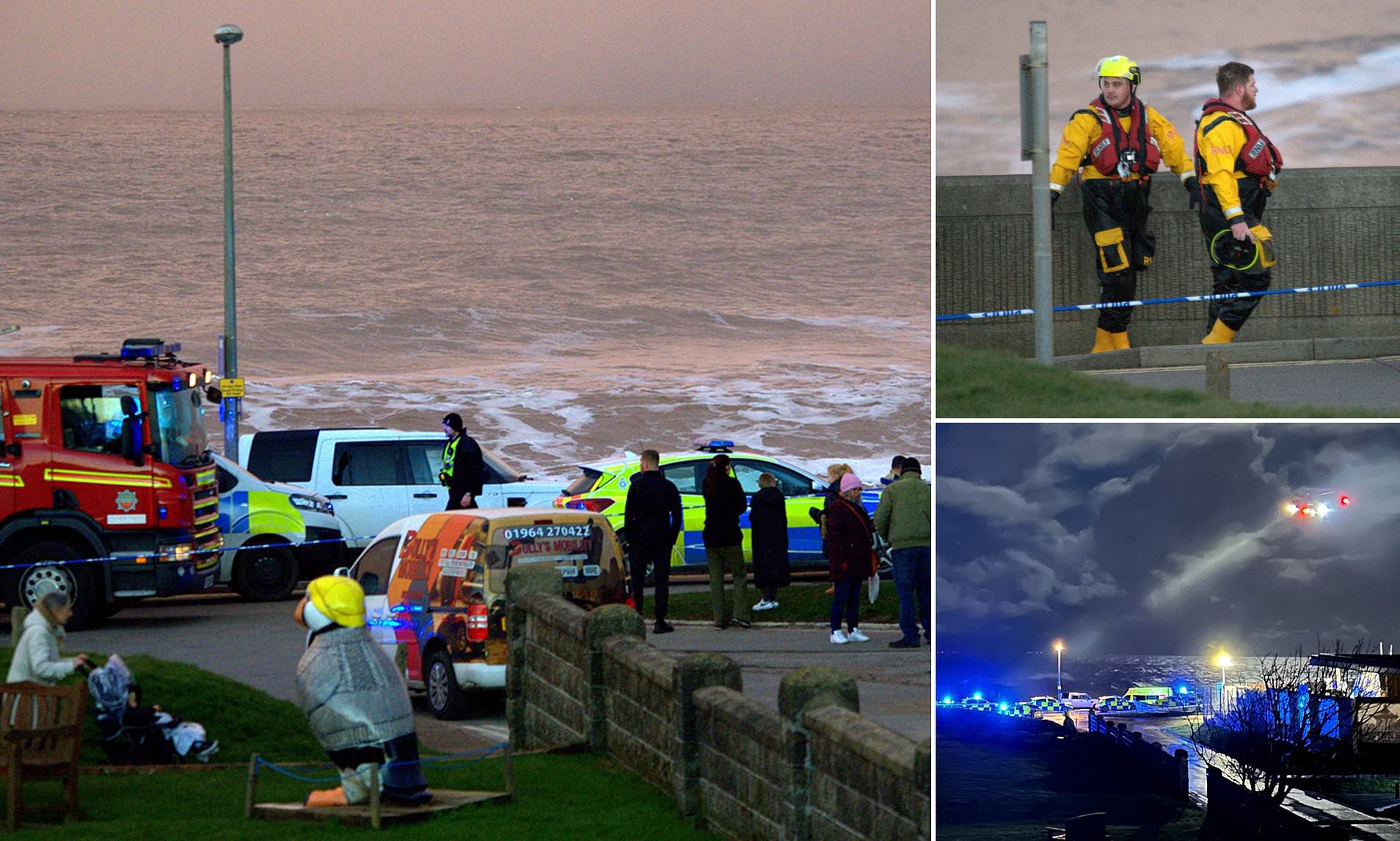 Double tragedy as at least two people die while 'trying to rescue teenage girl' from freezing sea