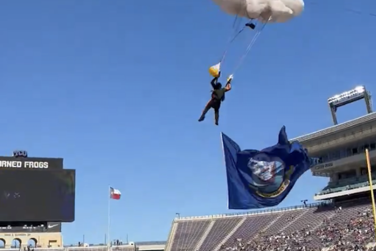 Parachutist suffers terrifying fall during stunt at Armed Forces Bowl