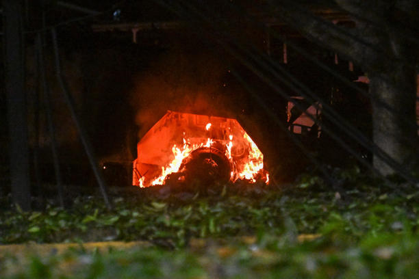A vehicle burns at La Carlota air base in Caracas after a series of explosions on Jan. 3, 2026. Loud explosions, accompanied by sounds resembling aircraft flyovers, were heard in Caracas around 2:00 am. The explosions come as President Donald Trump, who has deployed a navy task force to the Caribbean, raised the possibility of ground strikes against Venezuela.
