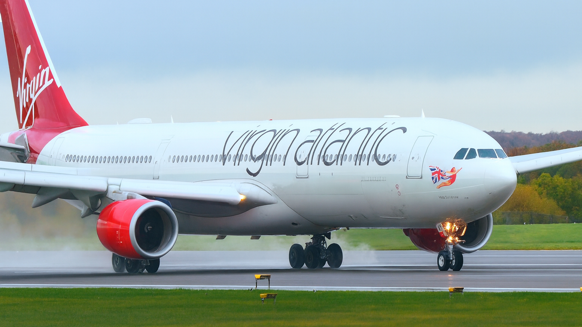 Commercial planes power through wet runway conditions