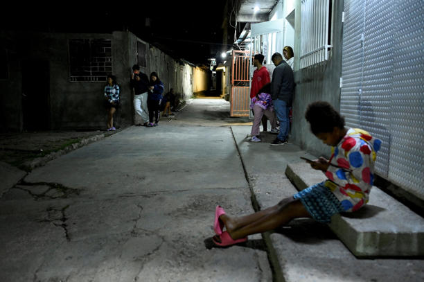 Residents are outside of their homes in the Gramoven neighborhood, as PREUTERS/Maxwell Briceno