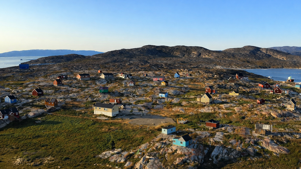 Tiny dwellings among vast northern rocks