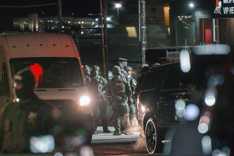 Olga Fedorova/EPA/Shutterstock - PHOTO: DEA agents are seen in front and inside of a van supposedly transporting Venezuelan President Nicolas Maduro from the Westside Heliport in New York City, January 3, 2026.