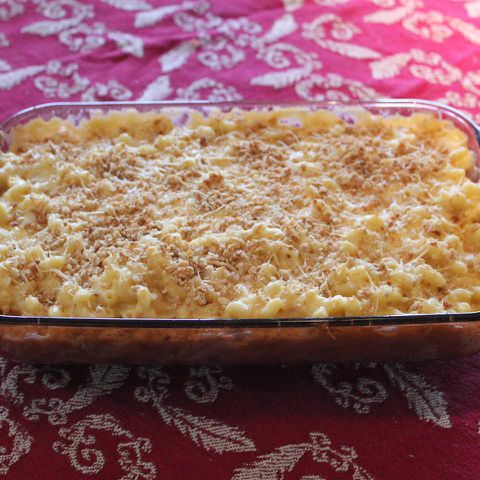 Four-Cheese Truffled Macaroni and Cheese on a red background