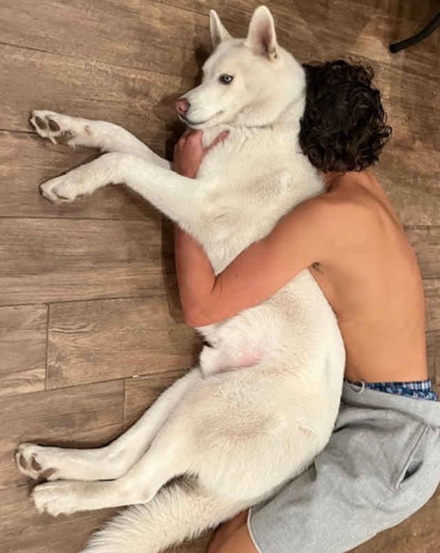 The author's son Sebastian spooning Zeus