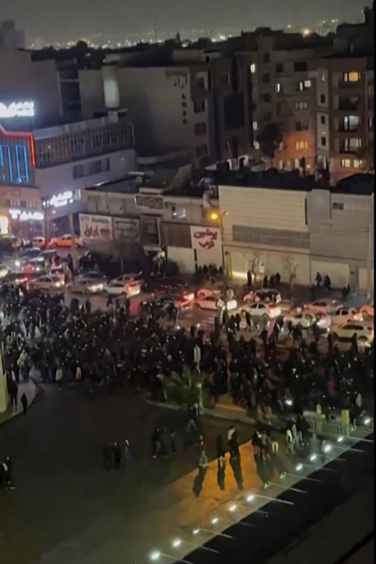 Protesters march in Tehran, the Iranian capital, in an image taken from video