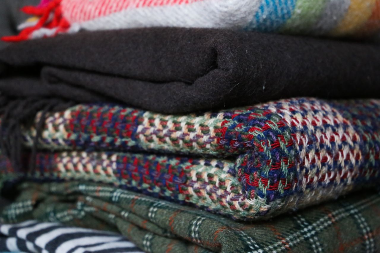 A pile of random blankets