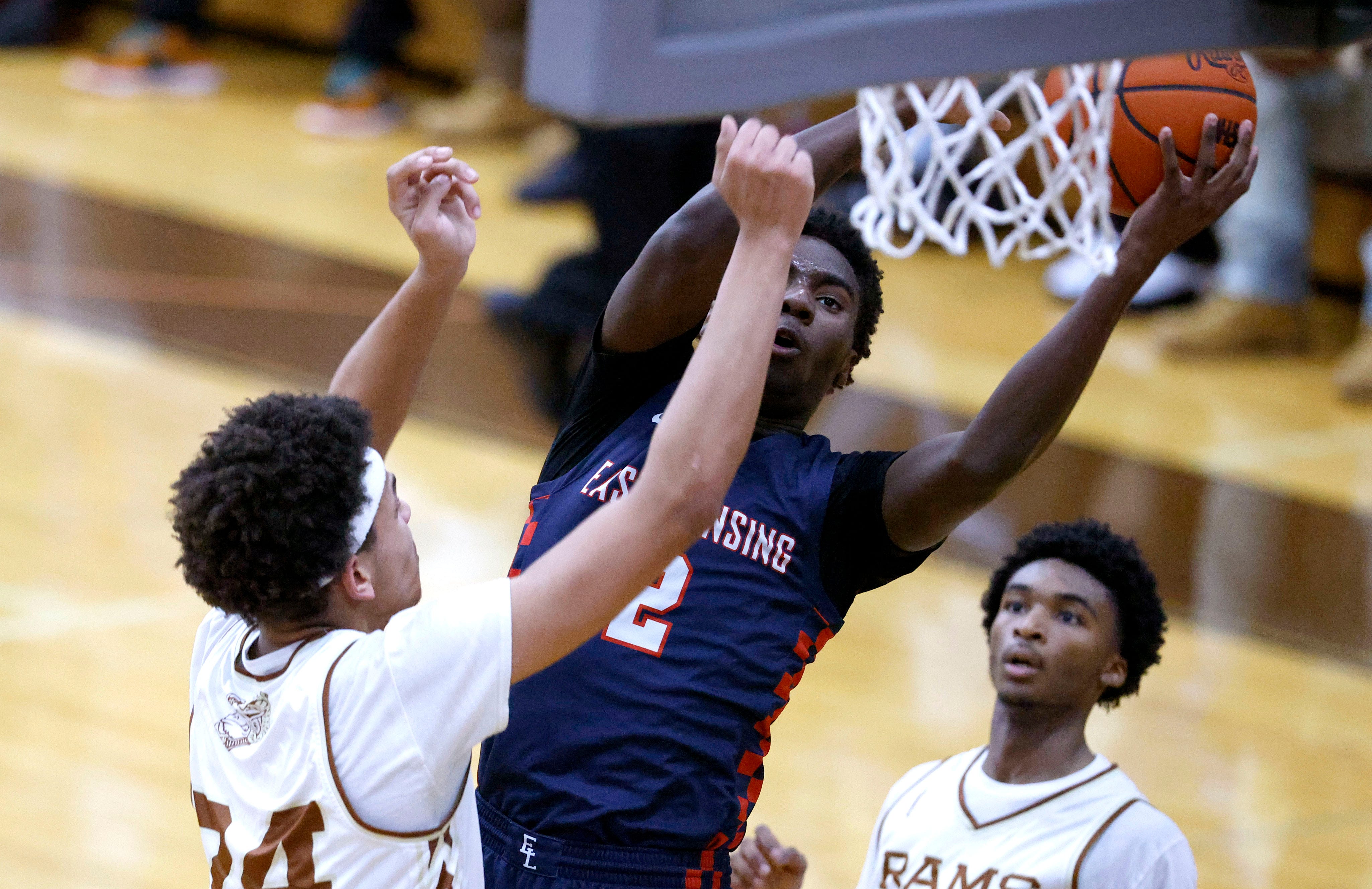 Boys basketball roundup: East Lansing captures outright CAAC Blue title
