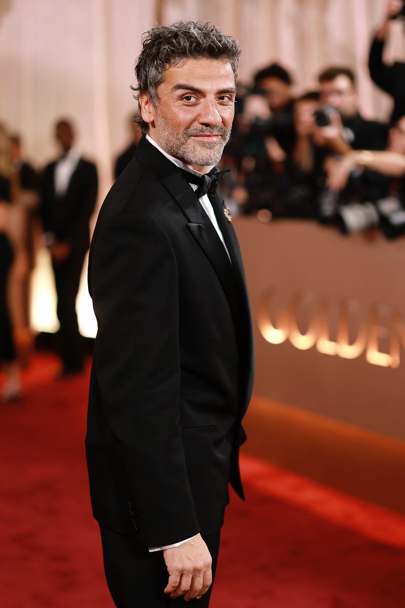 Oscar Isaac is stunningly handsome in a black tux and jeweled brooch at ...