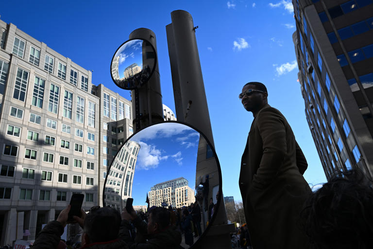 Protesters gather outside the U.S. Immigration and Customs Enforcement building.