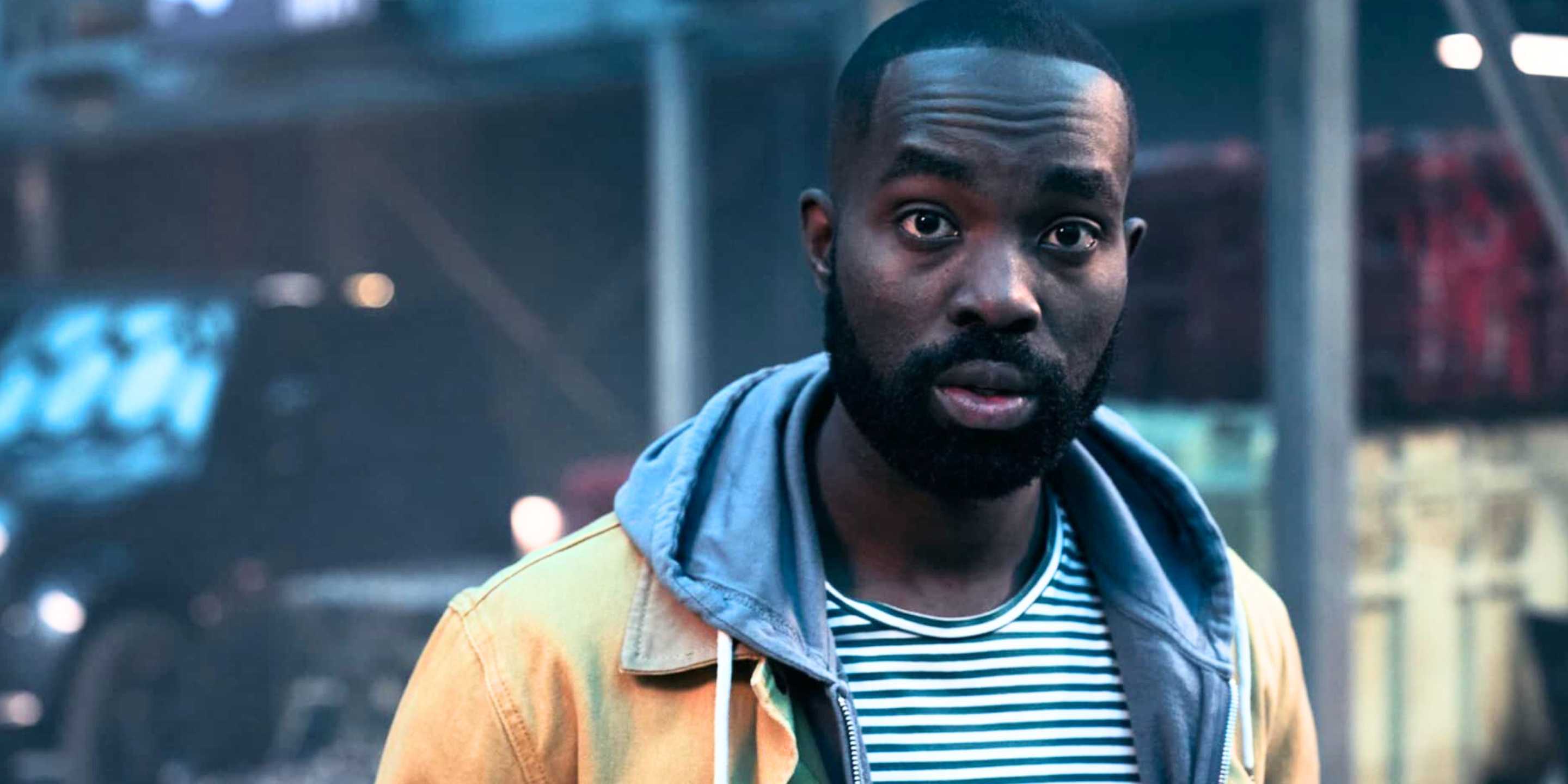 George looking surprised in The Lazarus Project