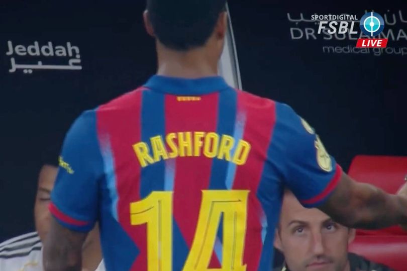 An individual wearing a football jersey with the number 14 and the surname 