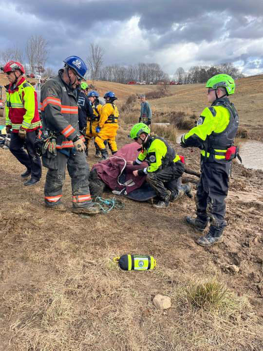 Crews team up to rescue cow stuck in muddy pond