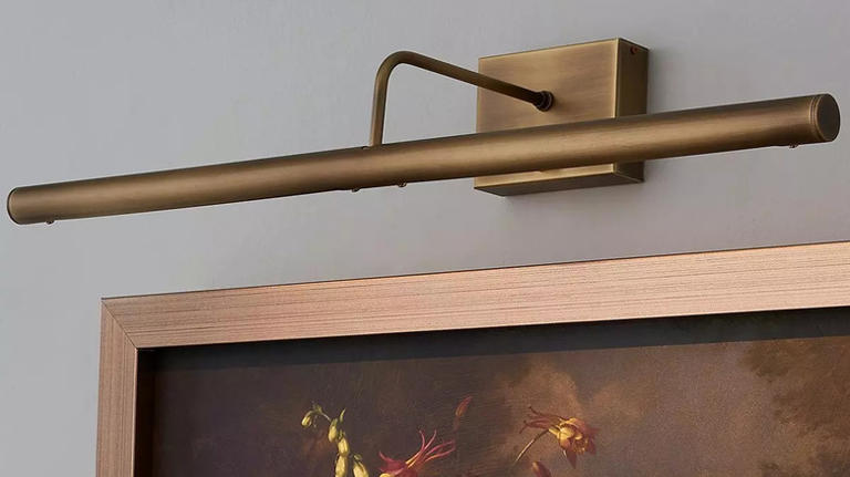 Use picture lights to make your wall art look worthy of a gallery