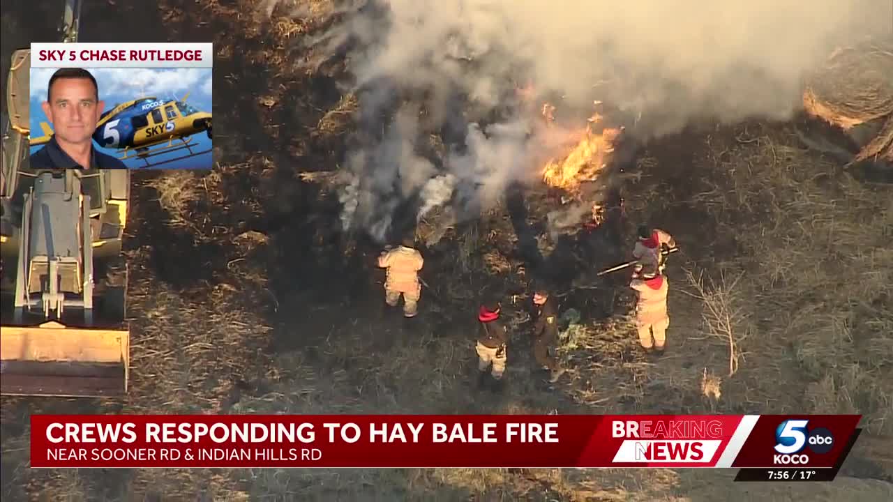 Crews work to extinguish hay bale fire near Norman