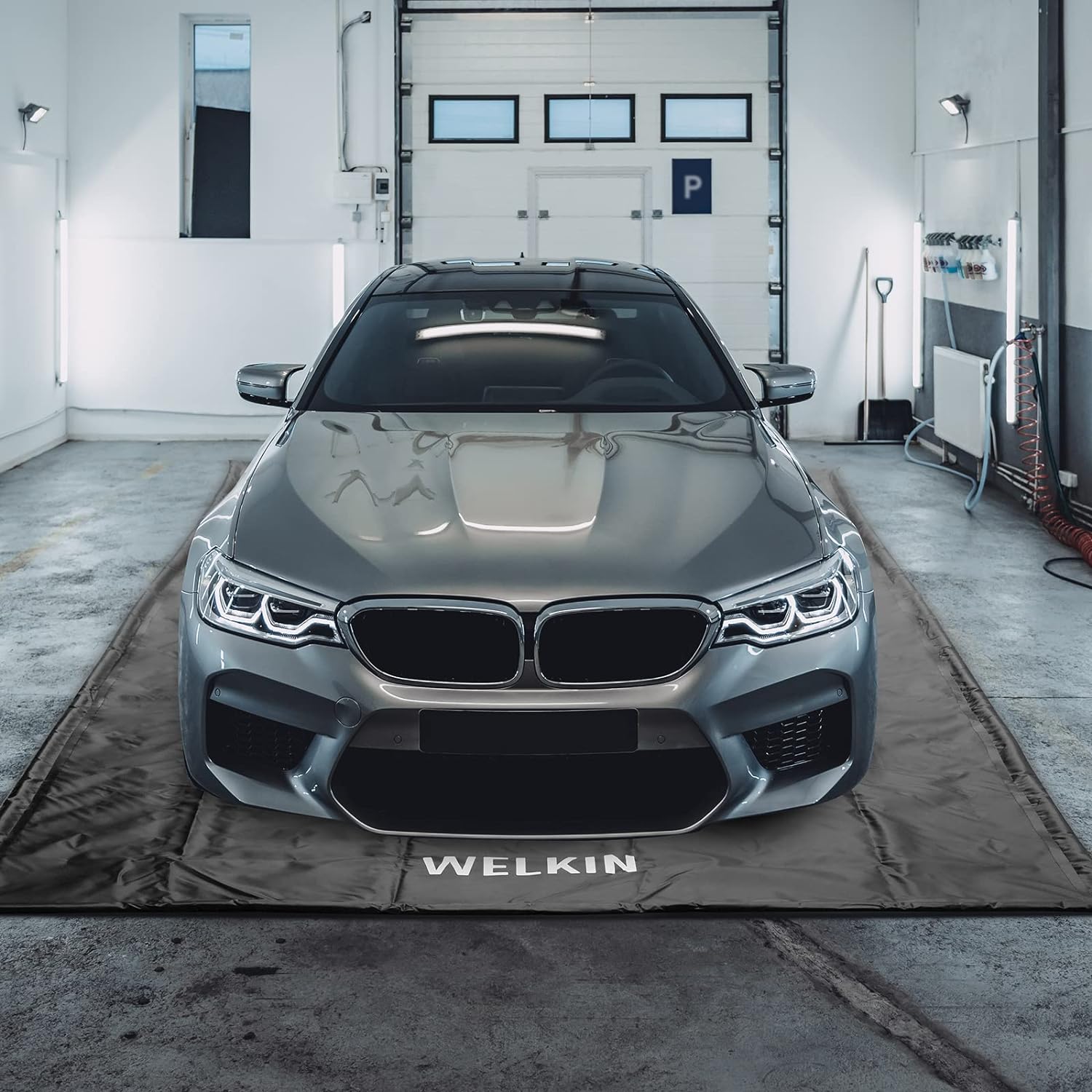 This heavy-duty garage mat keeps snowmelt and road grime off your floor