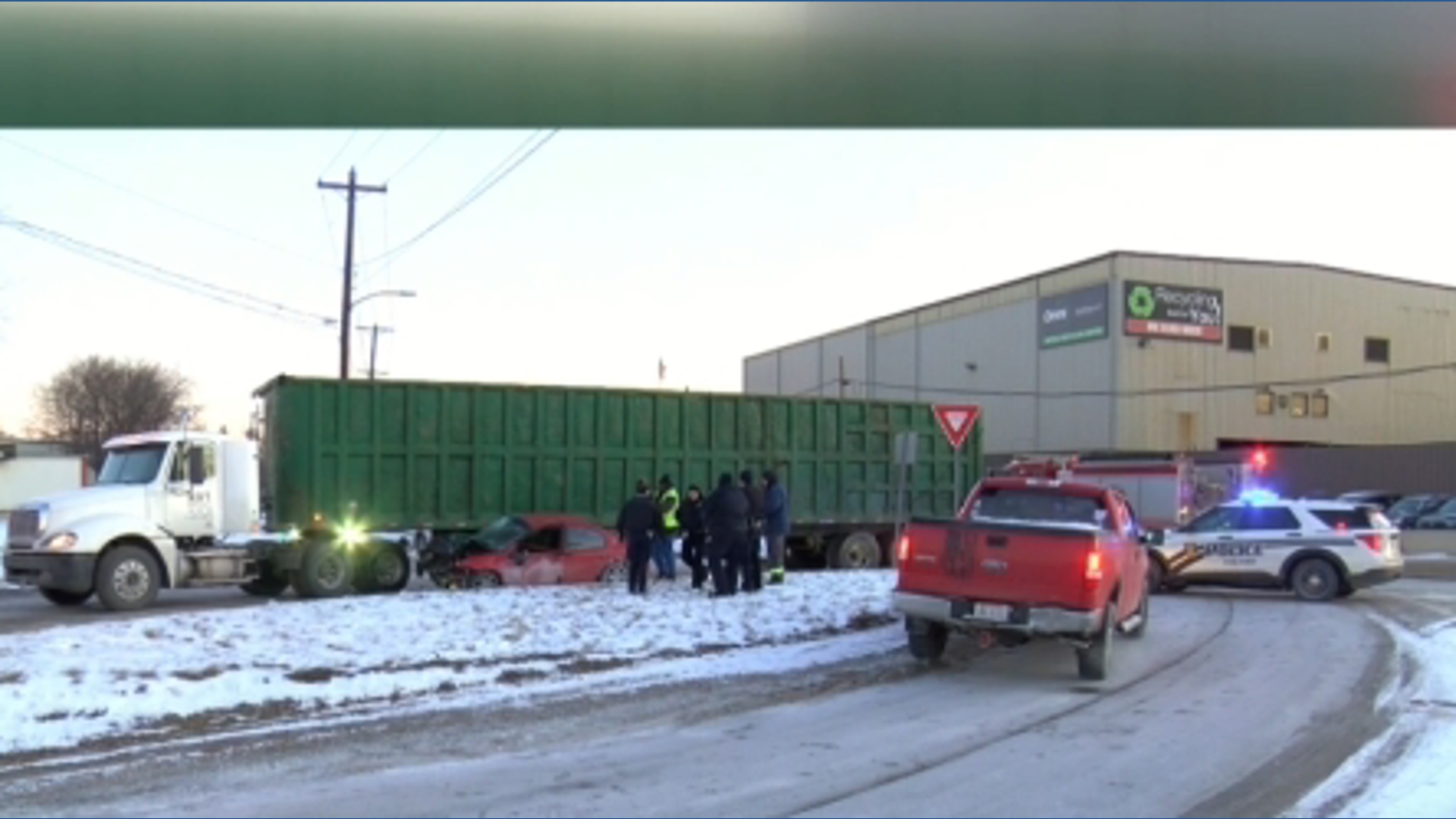 One person injured in west Toledo crash involving car under truck
