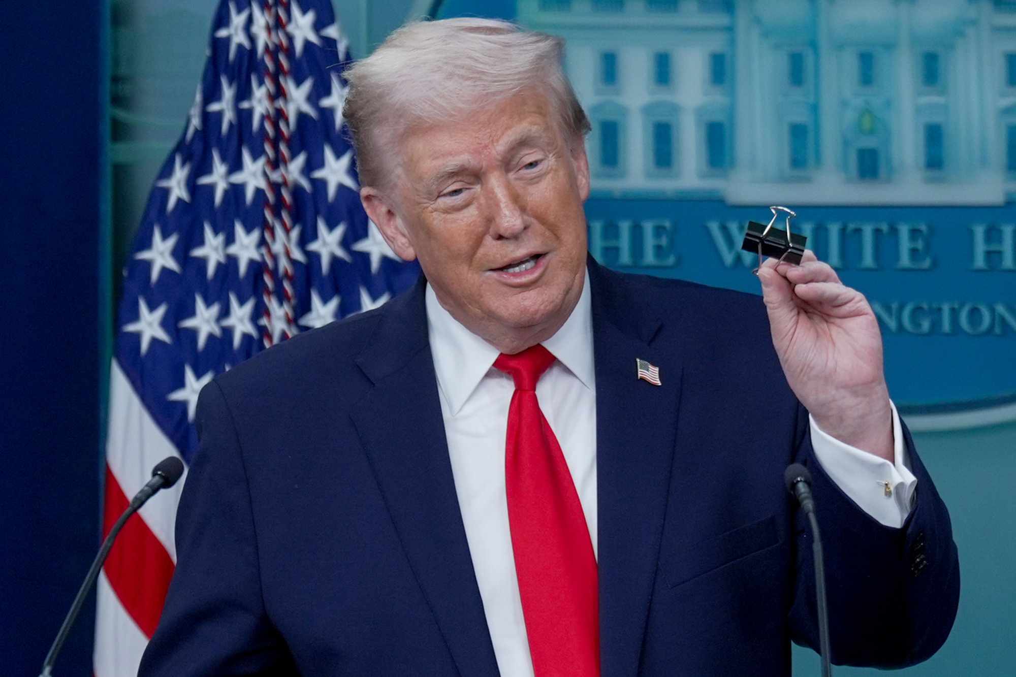 Donald Trump nearly shuts finger in simple paper clip on live TV ...