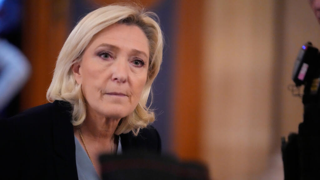 French farright leader Le Pen takes the stand, denies party had