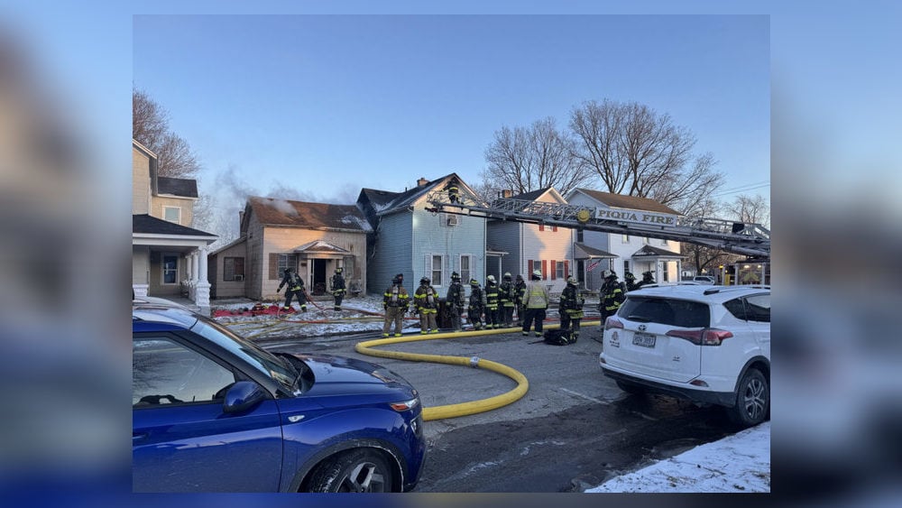 2 families displaced after house fire spreads to neighboring home