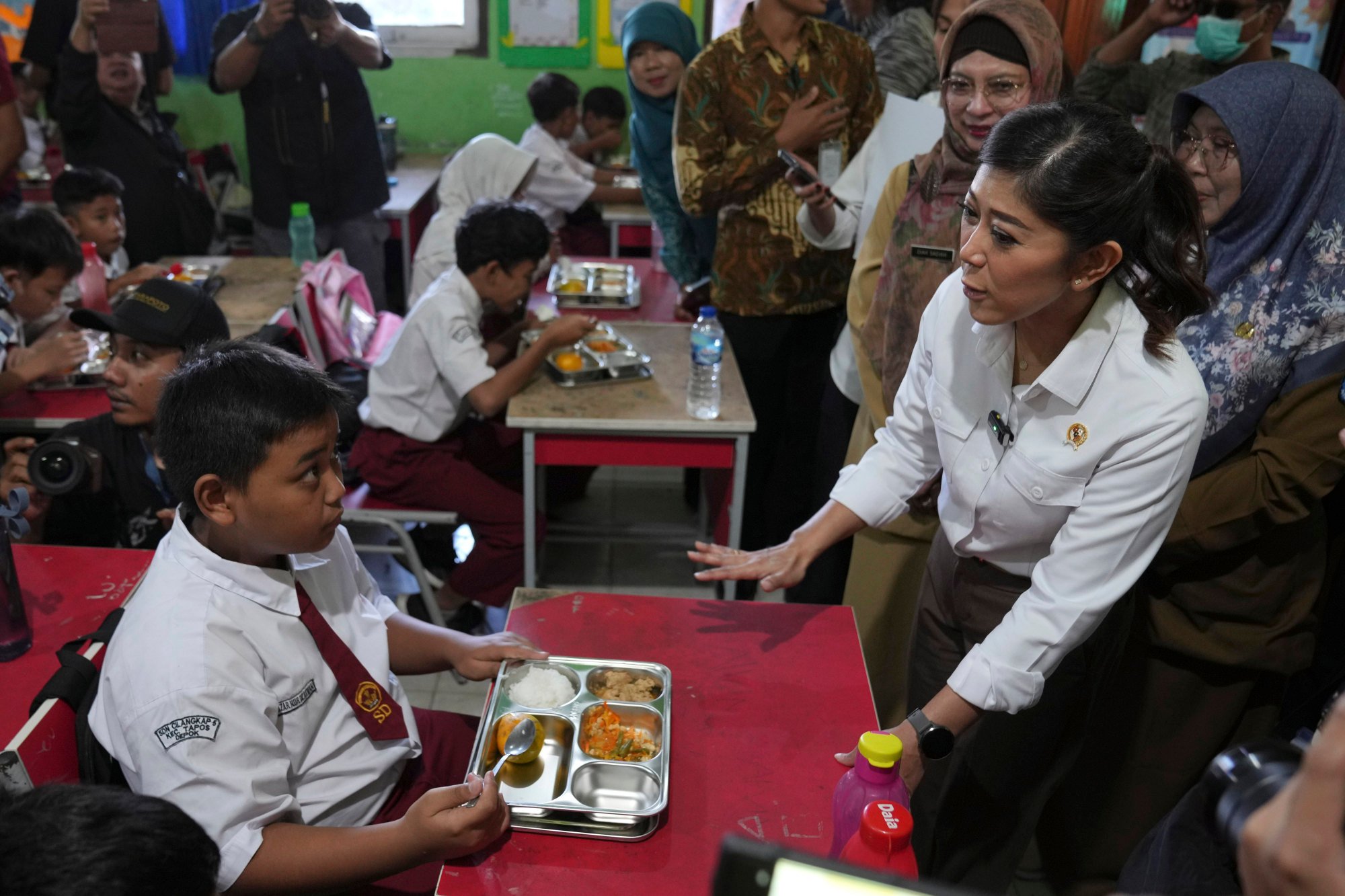 Indonesian Communications and Digital Affairs Minister Meutya Hafid (right) talks to students at a school in Depok, West Java, last year. Her ministry has summoned X officials to discuss concerns over deepfakes. Photo: AP