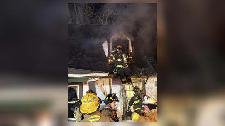 Firefighters deal with very cold temperatures in extinguishing house fire