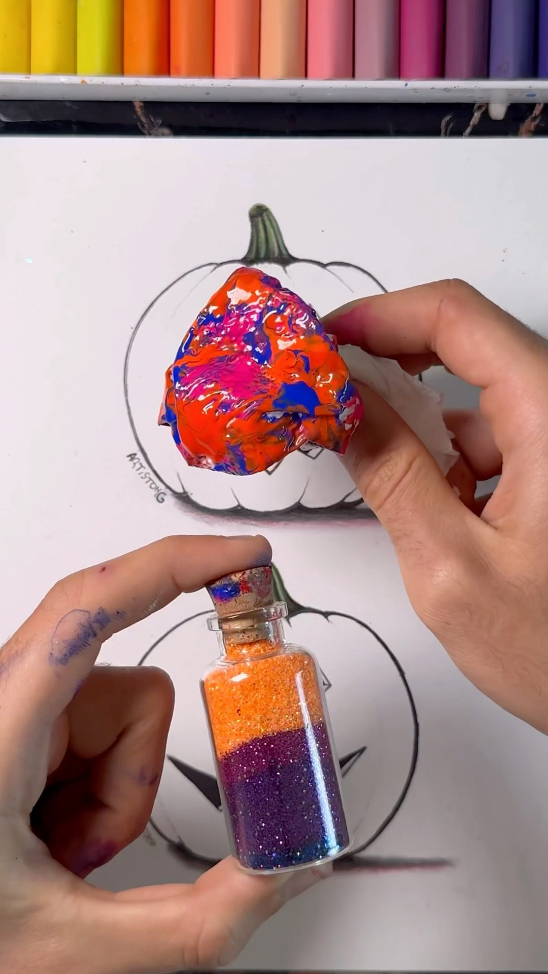 Comparing acrylic and glitter pumpkin art for Halloween