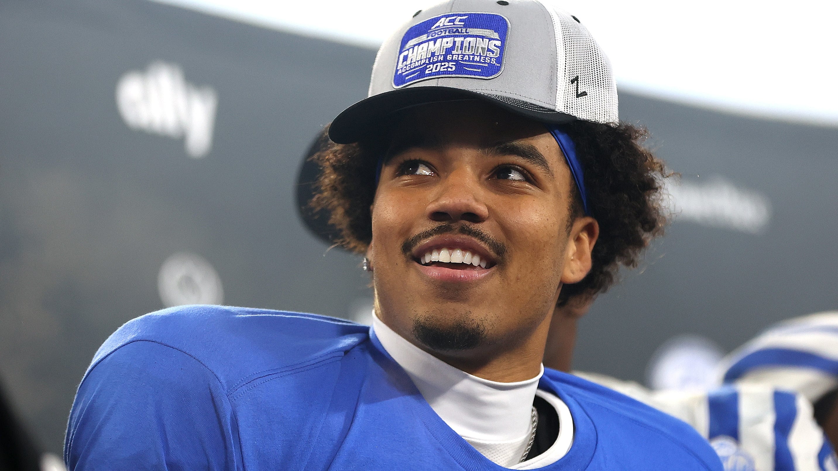 Star college quarterback sued by his own school
