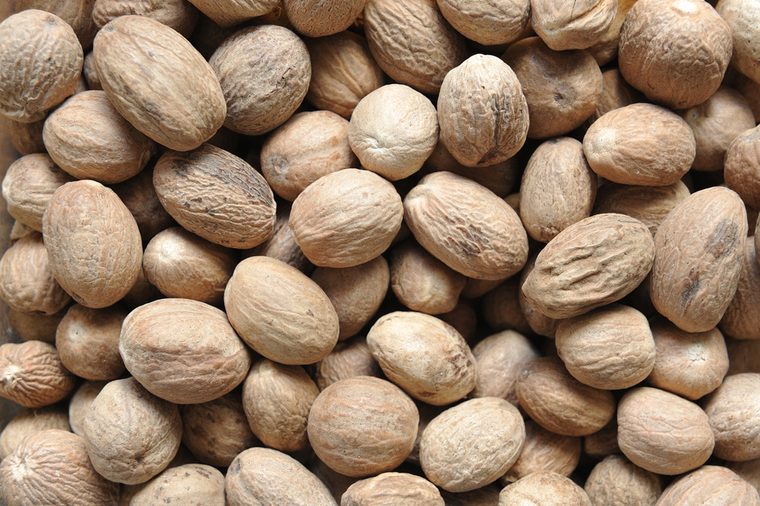 A beautiful and large nutmeg, close-up from a seller in the market