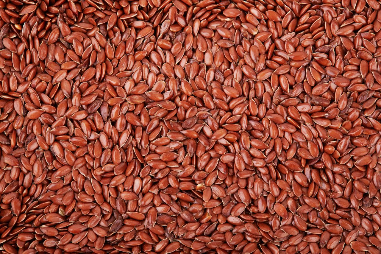 A closeup of flax seeds densely arranged