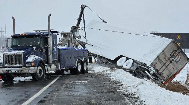 Police remove laundry detergent from overturned tractor trailer on I-81