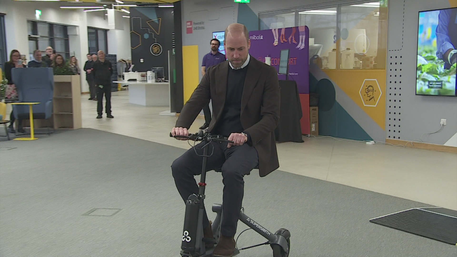 Prince of wheels: Will whizzes around in high tech scooter