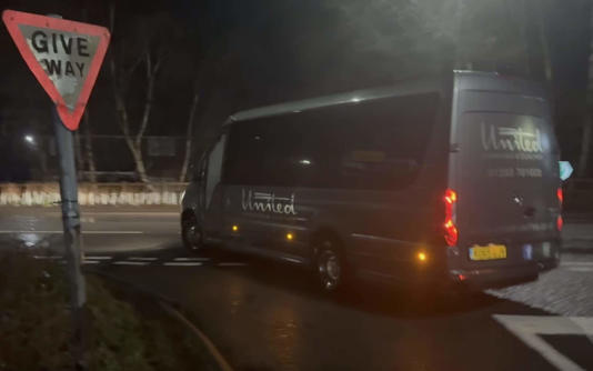 A coach arrives at the camp in Crowborough early on Thursday morning - Eddie Mitchell