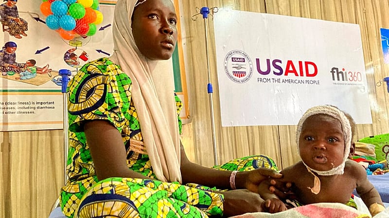 A woman attends to her malnourished child at the United Nations Nutrition Center in Banki, on the outskirts of Maiduguri, Nigeria, Tuesday, May 3, 2022.
