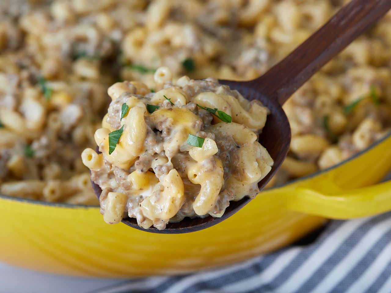 very close up on a spoonful of cheese and hamburger macaroni