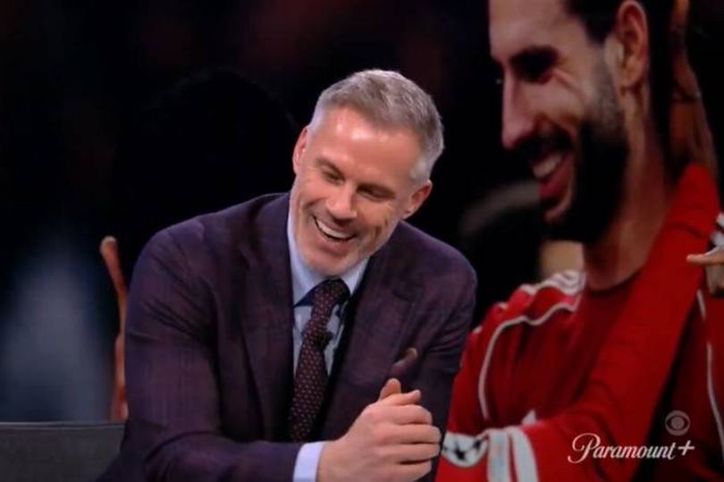 Jamie Carragher laughing in the CBS Sport studios