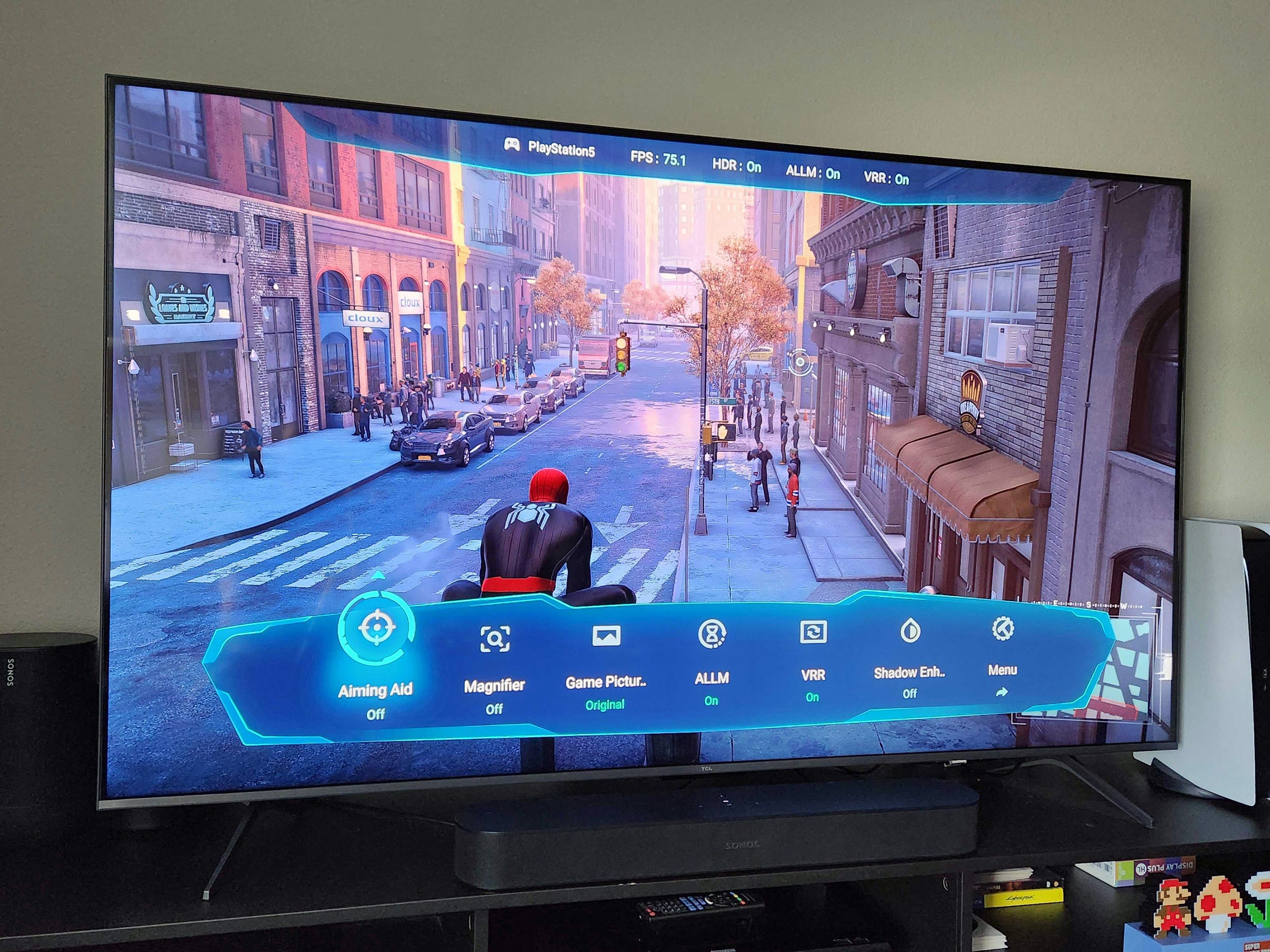 A TCL QM6K TV on a media console displaying
