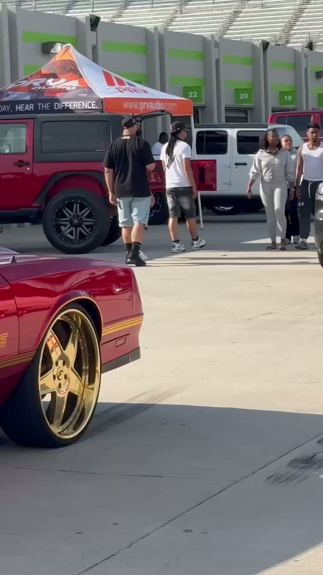 Red Chevy Monte Carlo SS on gold 24’s riding