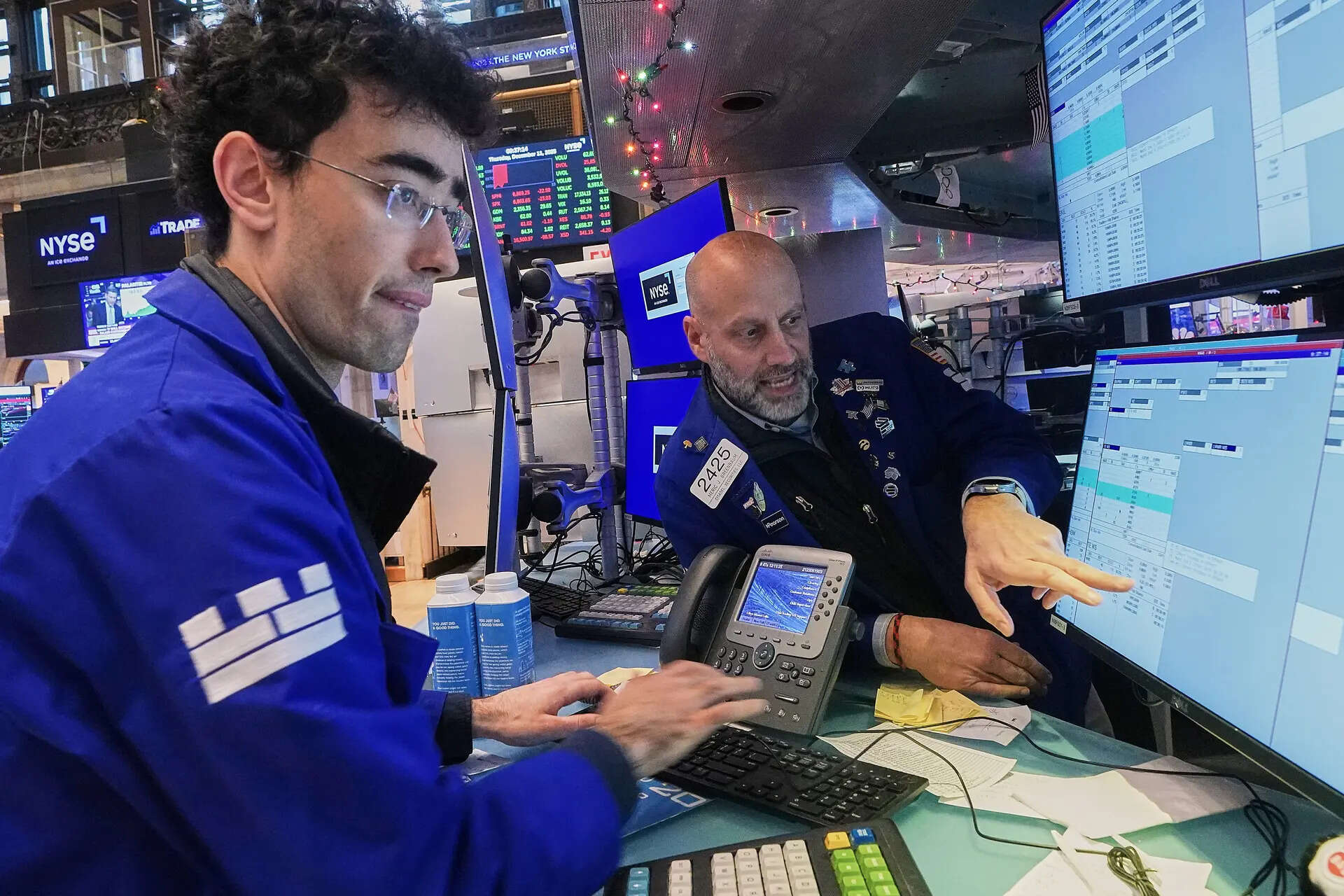 Wall Street finishes up as investors buoyed by tariff relief, upbeat data