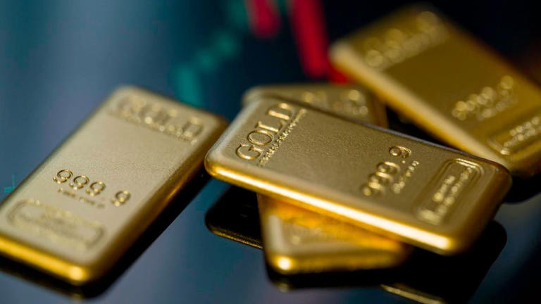 Silver breaks milestone $100 for the first time as gold nears $5,000